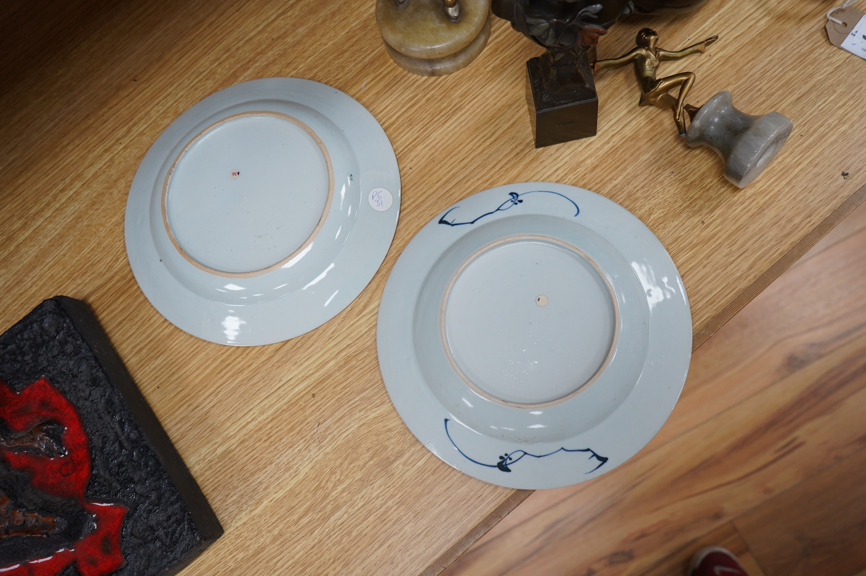 Two 18th century Chinese export plates, one blue and white the other famille rose, largest 23cm diameter. Condition - fair to good